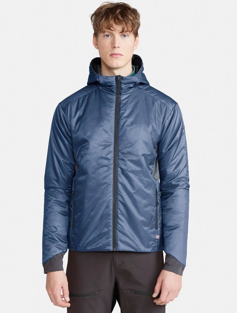 Męska lekka kurtka ocieplana Craft ADV Explore Lightweight w kolorze niebieskim – techniczna kurtka z poziomymi przeszyciami i logo Craft