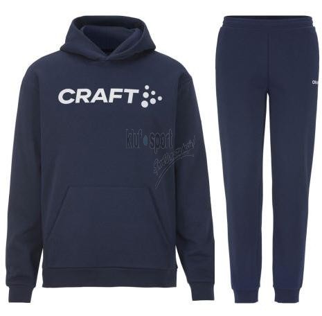 Męski dres bawełniany Craft Community 2.0 – granatowa bluza z kapturem i kieszenią typu kangurka oraz dopasowane granatowe spodnie dresowe.