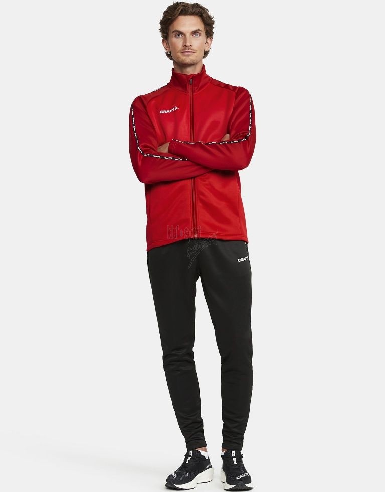 Męski dres treningowy Craft Squad 2.0 – czerwona bluza sportowa zapinana na zamek i czarne spodnie treningowe z logo Craft.
