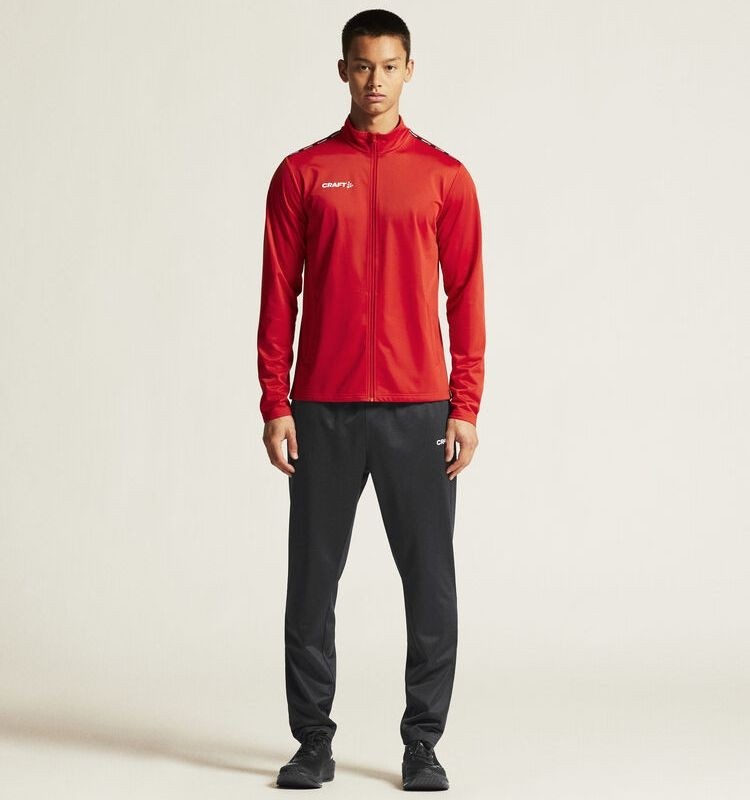 Męski dres treningowy Craft Squad Go – czerwona rozpinana bluza z logo Craft oraz czarne techniczne spodnie treningowe.