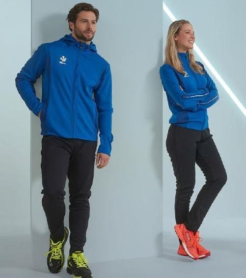 Męski dres sportowy Reece Australia Shift – niebieska rozpinana bluza z kapturem oraz dopasowane czarne spodnie treningowe z białym logo marki.