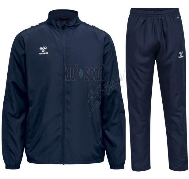 Męski dres sportowy Hummel Core XK Micro w kolorze granatowym – rozpinana bluza ze stójką i białymi szewronami oraz dopasowane spodnie treningowe.