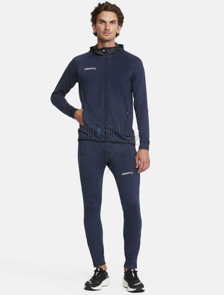 Granatowy męski dres treningowy CRAFT Extend PREMIUM – techniczna bluza z kapturem i zamkiem oraz dopasowane spodnie dresowe.