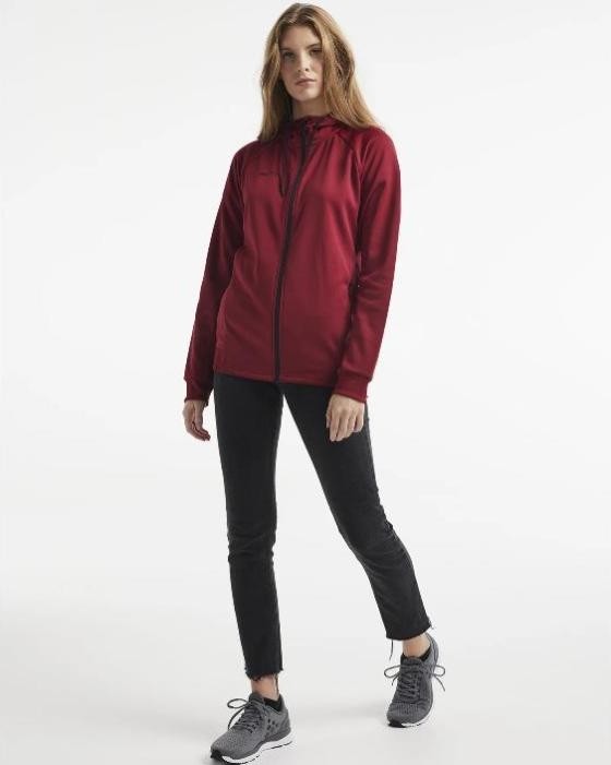 Damski dres sportowy z linii premium Craft ADV Unify – bordowa rozpinana bluza z kapturem i czarne spodnie treningowe o wysokiej jakości wykończeniu.