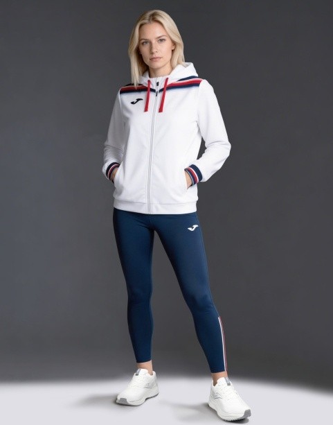 Damski dres tenisowy Joma Toledo II – biała bluza z kapturem zapinana na zamek oraz granatowe legginsy sportowe long tights.