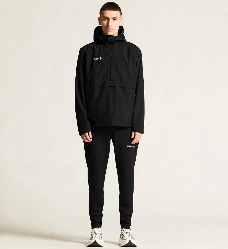 Męski komplet treningowy Craft Extend 2.0 – czarna kurtka sportowa rozpinana z wysoką stójką oraz dopasowane czarne spodnie treningowe.