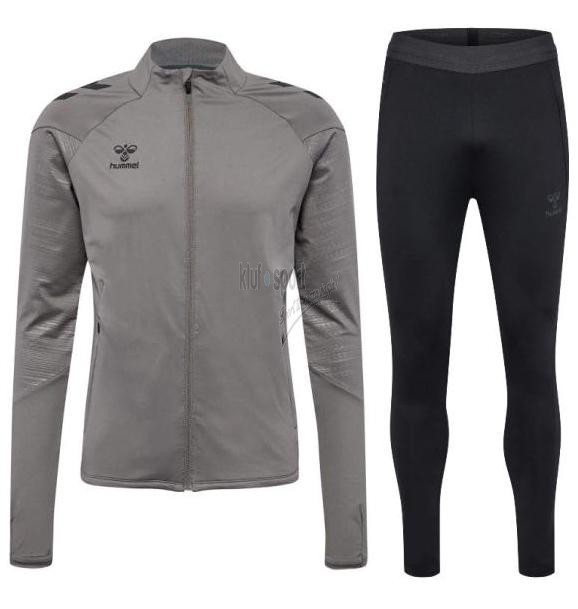 Męski dres treningowy Hummel Pro Training – popielata bluza treningowa rozpinana na zamek oraz czarne, dopasowane spodnie dresowe z technicznego materiału.