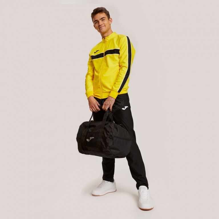 Męski dres treningowy Joma Victory – żółta bluza sportowa z pełnym zamkiem oraz czarne spodnie dresowe z logo Joma.