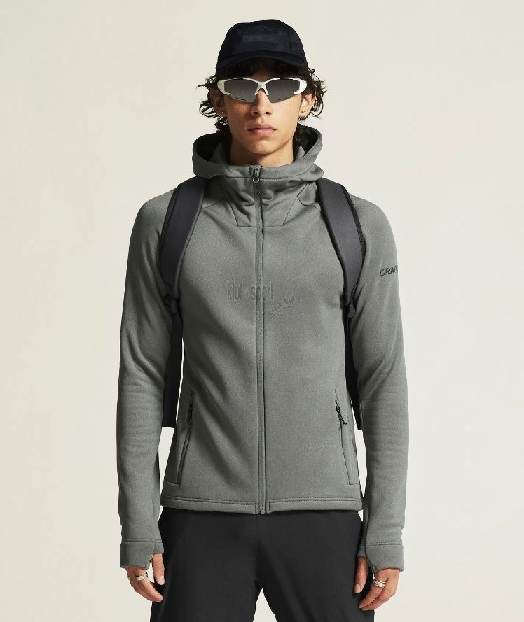 Męska kurtka sportowa Craft ADV Explore Power Fleece w kolorze szarym (popielatym) – techniczna bluza z kapturem i zapinanymi kieszeniami.