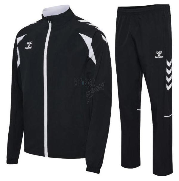 Męski dres sportowy Hummel Core 2.0 – czarna bluza rozpinana na biały zamek z białymi szewronami na ramionach oraz czarne spodnie z prostymi nogawkami.