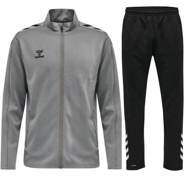 Męski dres treningowy Hummel Core XK – popielata bluza sportowa rozpinana na zamek oraz dopasowane czarne spodnie dresowe z białymi szewronami.