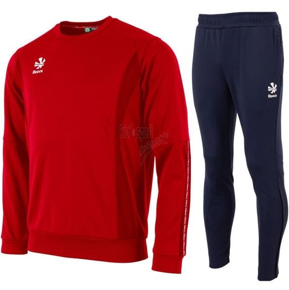 Męski dres treningowy Reece Australia Shift – czerwona bluza rozpinana ze stójką i granatowe spodnie sportowe z białymi detalami.