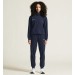 Damski dres treningowy Craft Community 2.0 w kolorze granatowym – rozpinana bluza z kapturem i białym logo oraz spodnie dresowe ze ściągaczami.