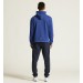 Męski dres bawełniany Craft Community 2.0 – niebieska bluza z kapturem wkładana przez głowę i granatowe spodnie dresowe ze ściągaczami.